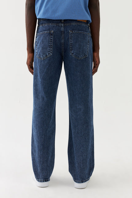 Jeans larghi in denim Sauvage Blau