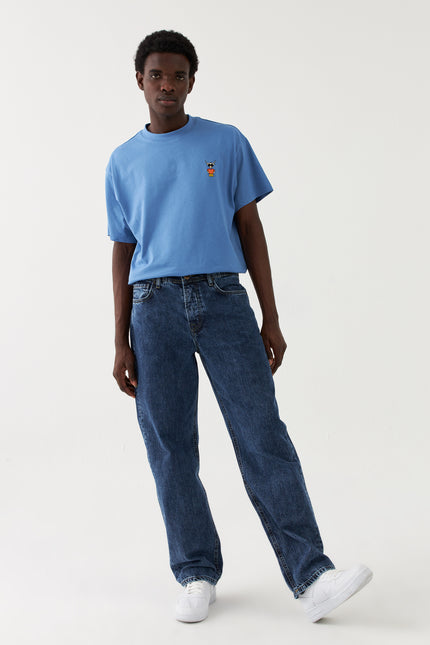 Jeans larghi in denim Sauvage Blau